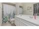 Bathroom features a shower and tub combination and a double sink vanity with large mirror at 21840 N 260Th Ln, Buckeye, AZ 85396