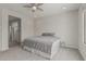 This bedroom features a ceiling fan and a carpeted floor at 21840 N 260Th Ln, Buckeye, AZ 85396