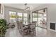 Charming dining room features a large wooden table and a glass sliding door for natural light at 21840 N 260Th Ln, Buckeye, AZ 85396