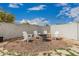 Cozy backyard fire pit with Adirondack chairs, perfect for outdoor gatherings and relaxation at 21840 N 260Th Ln, Buckeye, AZ 85396