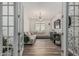 Stylish living room featuring a brick accent wall, modern lighting, and cozy seating at 21840 N 260Th Ln, Buckeye, AZ 85396