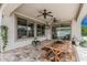 Outdoor patio with a dining table, ceiling fans, and tiled floors at 21840 N 260Th Ln, Buckeye, AZ 85396