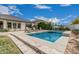 Inviting backyard pool with chaise lounges and clean landscaping, perfect for outdoor relaxation at 21840 N 260Th Ln, Buckeye, AZ 85396