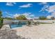 Relaxing backyard pool area with lounge chairs and attractive tile features at 21840 N 260Th Ln, Buckeye, AZ 85396