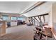 Bright bonus room featuring an exercise area, a work space and multiple windows at 2308 E State Ave, Phoenix, AZ 85020