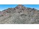 A desert mountain landscape with steep inclines and visible hiking trails winding through rugged terrain at 2308 E State Ave, Phoenix, AZ 85020