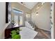 Bright entryway boasts modern stairs, an open floorplan, and stylish decor elements at 2308 E State Ave, Phoenix, AZ 85020