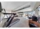 Bright exercise room featuring a treadmill, rower, and open layout with natural light from windows at 2308 E State Ave, Phoenix, AZ 85020