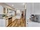 Bright kitchen with granite countertops, stainless steel appliances, and stylish white cabinets at 2308 E State Ave, Phoenix, AZ 85020