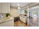 Convenient laundry area features modern units and ample storage space with granite countertops at 2308 E State Ave, Phoenix, AZ 85020
