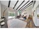 Open living room boasts high ceilings, fireplace, and sliding glass doors to the patio at 2308 E State Ave, Phoenix, AZ 85020