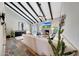Spacious living room features vaulted ceiling, exposed beams, and a cozy fireplace at 2308 E State Ave, Phoenix, AZ 85020
