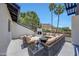 Charming outdoor patio features a fireplace, lounge seating, and scenic views, perfect for entertaining at 2308 E State Ave, Phoenix, AZ 85020
