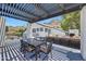 Relaxing outdoor patio features a dining table, mountain views, lounge seating, and a pergola at 2308 E State Ave, Phoenix, AZ 85020