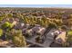 The aerial perspective displays the community, revealing the area's homes, greenery, and sunny skies at 4554 S Cobblestone St, Gilbert, AZ 85297