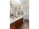 Bathroom featuring double sinks, tile floors, and a separate toilet room at 4554 S Cobblestone St, Gilbert, AZ 85297