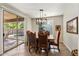 Bright dining area with sliding glass doors to the patio and lovely backyard at 4554 S Cobblestone St, Gilbert, AZ 85297