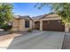 Charming single story home featuring a well-manicured yard and two car garage at 4554 S Cobblestone St, Gilbert, AZ 85297