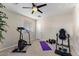 Well-equipped home gym with various workout machines and plenty of open space at 4554 S Cobblestone St, Gilbert, AZ 85297