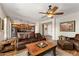 Open living room and kitchen area, featuring hardwood floors and natural light at 4554 S Cobblestone St, Gilbert, AZ 85297