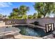 Backyard with a refreshing pool and a basketball hoop at 4554 S Cobblestone St, Gilbert, AZ 85297