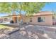 The backyard boasts a covered patio, barbecue area, and a mature shade tree enhancing outdoor enjoyment at 6102 W Shangri La Rd, Glendale, AZ 85304