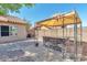 A backyard featuring a stone bar, patio, and desert landscaping creating a relaxing outdoor space at 6102 W Shangri La Rd, Glendale, AZ 85304