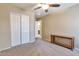 Neutral bedroom featuring double closet and ceiling fan, offering a calm and inviting space at 6102 W Shangri La Rd, Glendale, AZ 85304