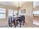 Dining area featuring a chandelier and large window at 6102 W Shangri La Rd, Glendale, AZ 85304