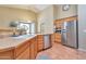 Bright kitchen with stainless steel appliances, tiled floors, and natural light at 6102 W Shangri La Rd, Glendale, AZ 85304