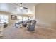 Spacious living room with plush carpeting and an open concept design at 6102 W Shangri La Rd, Glendale, AZ 85304