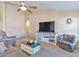 Comfortable living room with a large TV and plenty of seating at 6102 W Shangri La Rd, Glendale, AZ 85304