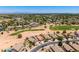 Expansive aerial view of a desert community with a golf course and mountain views at 6557 S Classic Way, Gilbert, AZ 85298