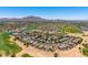 Scenic aerial view showcasing a Primary-planned desert community with pools and golf courses at 6557 S Classic Way, Gilbert, AZ 85298