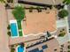 Bird's-eye view featuring a backyard pool, solar panels, and desert landscaping at 6557 S Classic Way, Gilbert, AZ 85298