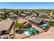 Aerial view of a desert home featuring a refreshing pool and a well-maintained backyard at 6557 S Classic Way, Gilbert, AZ 85298