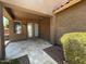 Covered patio with paved flooring looking onto backyard with custom bushes at 6557 S Classic Way, Gilbert, AZ 85298