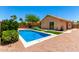 Amazing backyard showcasing a sparkling pool, desert landscaping, and mature trees for shade at 6557 S Classic Way, Gilbert, AZ 85298