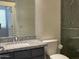 Bathroom featuring a toilet and a single sink vanity with granite countertops and a shower in the background at 6557 S Classic Way, Gilbert, AZ 85298