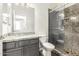 Bathroom featuring a shower, toilet, and granite countertop sink at 6557 S Classic Way, Gilbert, AZ 85298