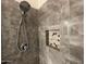 Beautiful bathroom shower featuring rainfall showerhead and decorative stone niche at 6557 S Classic Way, Gilbert, AZ 85298