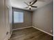 Bedroom with ceiling fan, wood floors, closet and windows, perfect for relaxing and resting at 6557 S Classic Way, Gilbert, AZ 85298