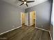 Bedroom with ceiling fan, wood floors, closet and windows, perfect for relaxing and resting at 6557 S Classic Way, Gilbert, AZ 85298