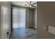 Bedroom featuring vinyl floors, ceiling fan, and window with blinds at 6557 S Classic Way, Gilbert, AZ 85298
