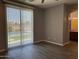 Spacious bedroom with wood-look floors, sliding doors leading to a backyard pool at 6557 S Classic Way, Gilbert, AZ 85298
