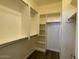 Bright walk-in closet with ample shelving and hanging space, perfect for organizing clothes and accessories at 6557 S Classic Way, Gilbert, AZ 85298