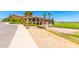 Beautiful clubhouse overlooking golf course, featuring lush landscaping and outdoor dining areas at 6557 S Classic Way, Gilbert, AZ 85298
