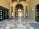 The clubhouse showcases a grand entrance with an arched walkway and elegant tile flooring at 6557 S Classic Way, Gilbert, AZ 85298
