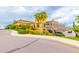 Elegant clubhouse on a golf course, with landscaping, lush trees, and a grand entrance at 6557 S Classic Way, Gilbert, AZ 85298