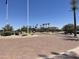 Community entrance features manicured landscaping and lush plants and shrubs at 6557 S Classic Way, Gilbert, AZ 85298
